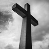 cross against backdrop of black and white sky