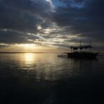boat on water under dark skies