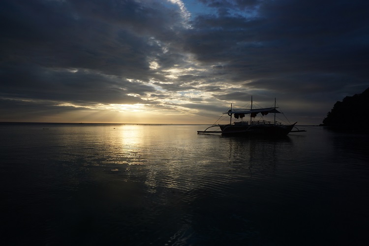 boat on water under dark skies