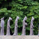 little friar figures in a monument in Italy