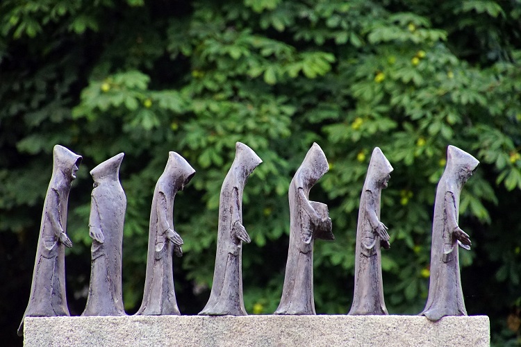 little friar figures in a monument in Italy